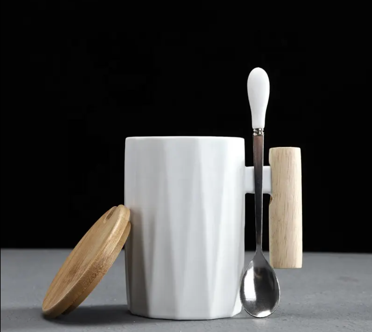 White nordic coffee cup with a gift box